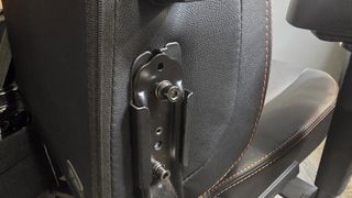 The bolts on the side of the AndaSeat Kaiser 3 Pro.