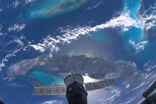 Italian astronaut Paolo Nespoli photographs a Russian Soyuz spacecraft with a Caribbean island as the backdrop in this photo from the International Space Station on Jan. 8, 2011.