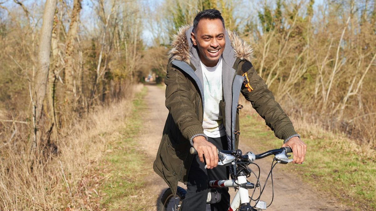 Man cycling on track