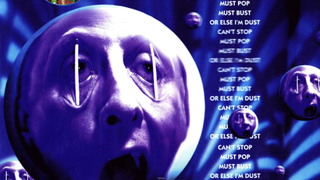 A man with his eyes forcibly held open by sticks proclaims he must bust or else he's dust in advertisement for a game called 'Bust-A-Move'.