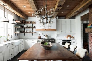 rustic kitchen with modern cabinetry and exposed wooden beams