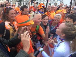 Anna Van der Breggen celebrates with her family and friends after receiving her rainbow jersey as winner of the elite women's road race at the 2018 UCI Road World Championships in Innsbruck, Austria