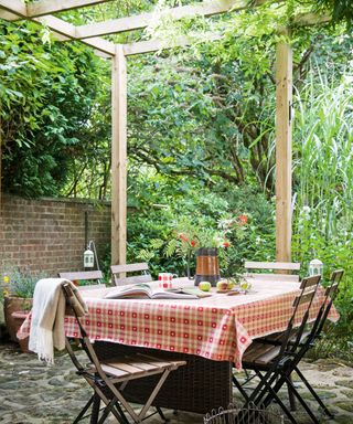 Pergola above table in garden