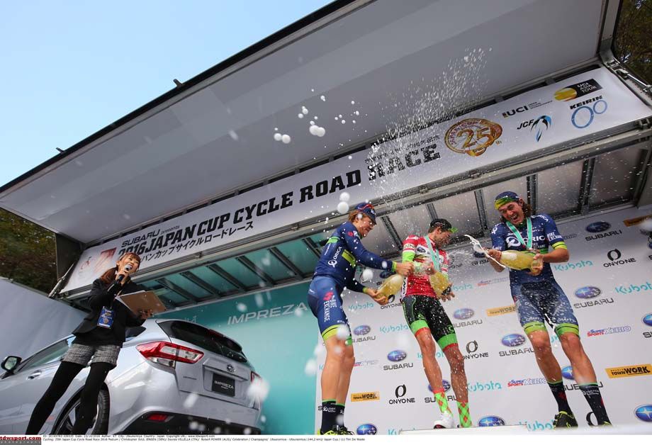 The riders spray the champagne