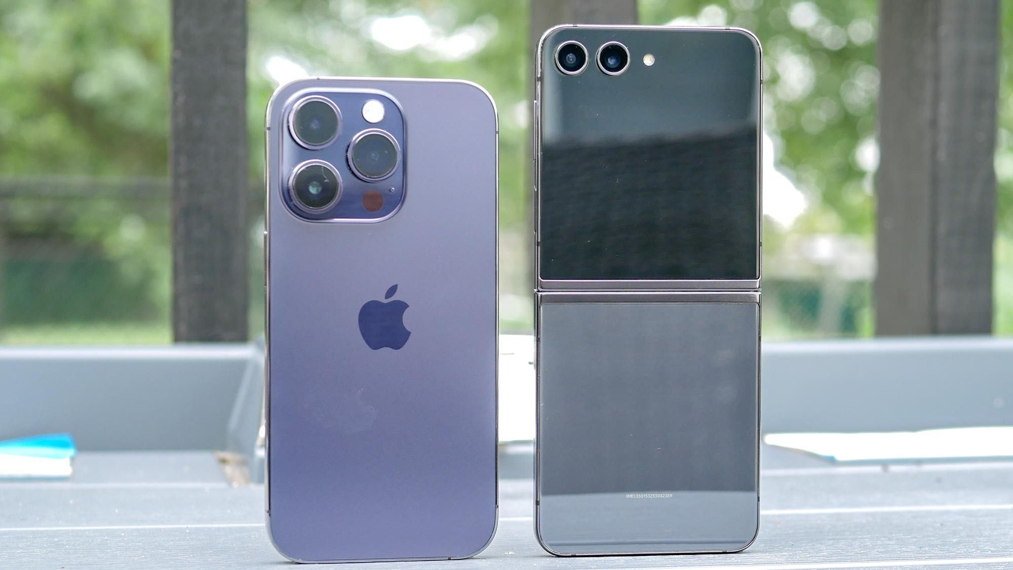 Side-by-side comparison of Apple iPhone 14 Pro Max and Samsung Galaxy Z Flip 5.