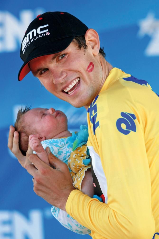 Tejay van Garderen on the podium in California with his young child