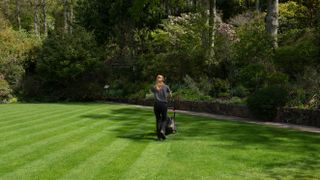 Woman striping a lawn