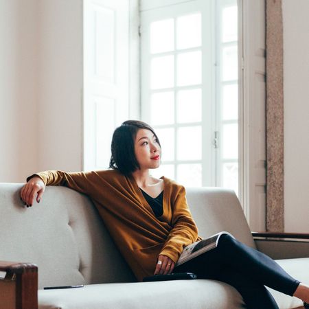 Woman sitting on sofa