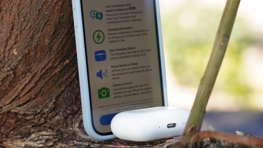 The AirPods Pro 3 with their charging case at a park. 