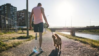 Man walking a dog on a leash