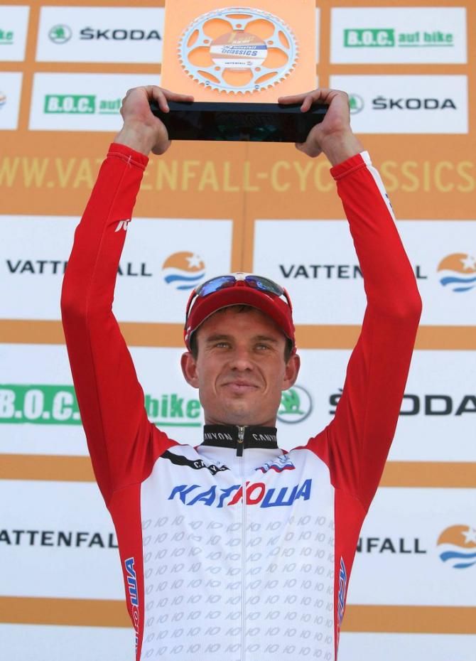 Alexander Kristoff (Katusha) holds the winners trophy aloft