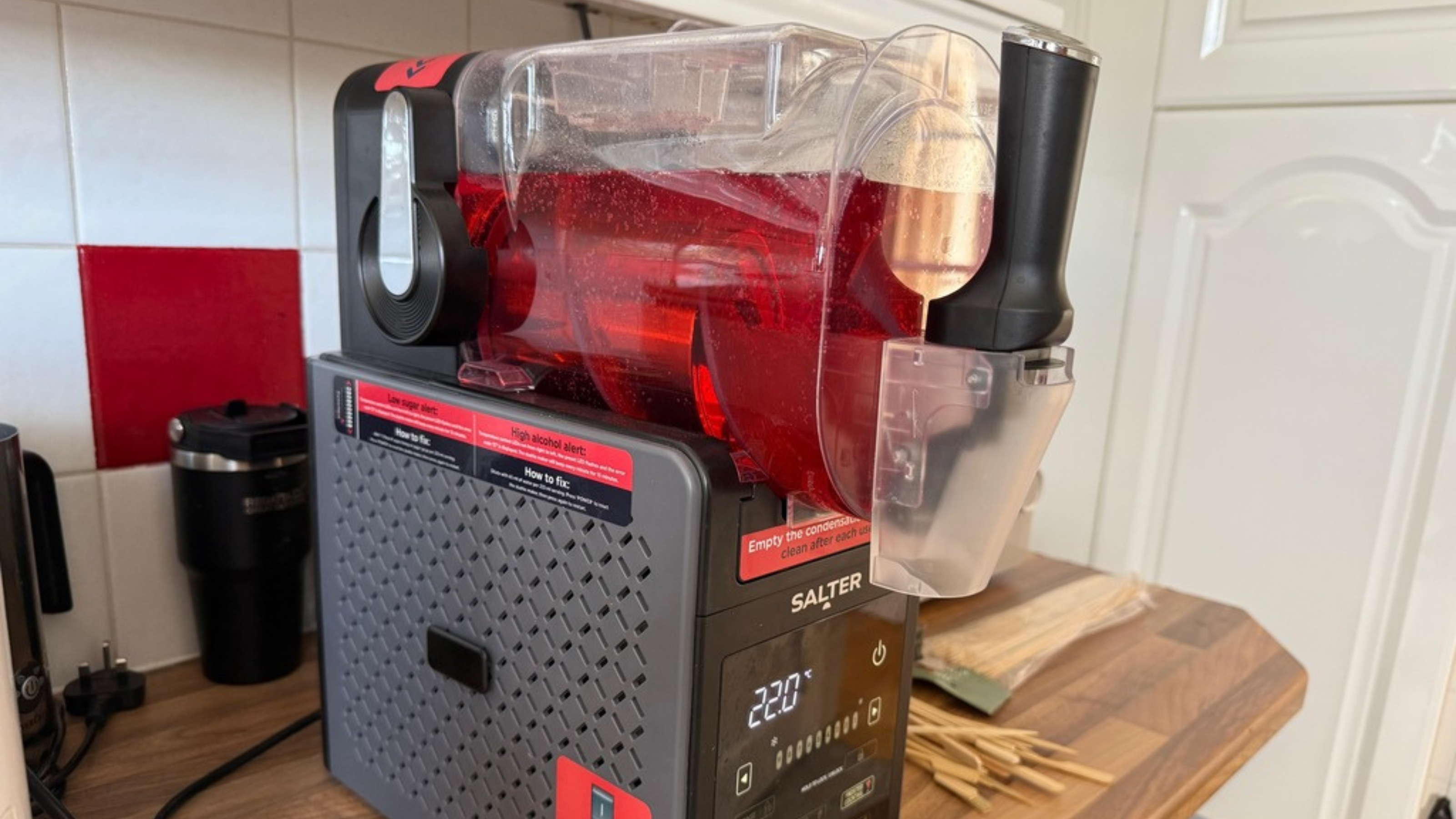 Salter Slushie Machine on Kicthen worktop making raspberry slush.