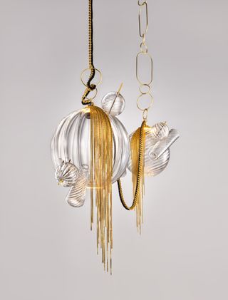 Lindsey Adelman lighting with spheres and gold chains