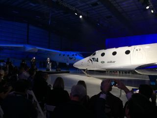 Richard Branson addressed reporters and guests at the unveiling of Virgin Galactic's new SpaceShipTwo space plane.
