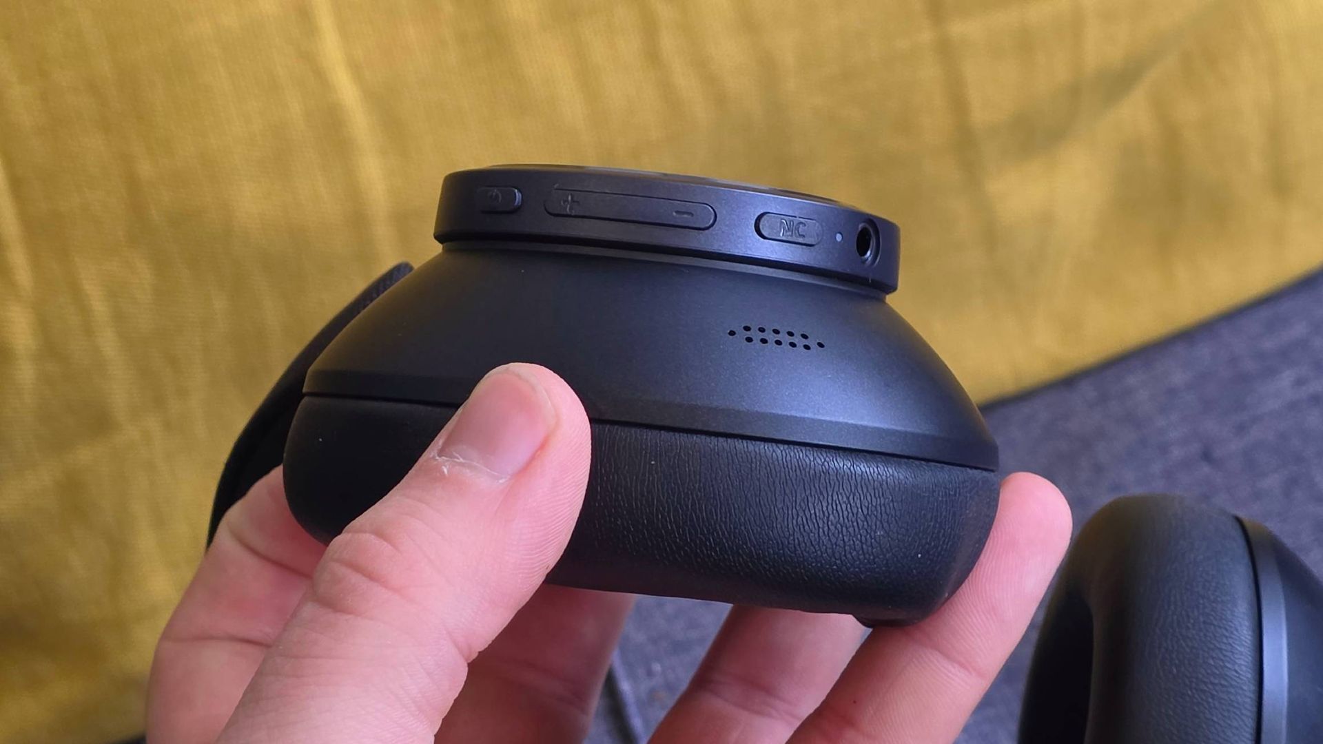 The Earfun Wave Pro X's cup, showing an array of buttons.