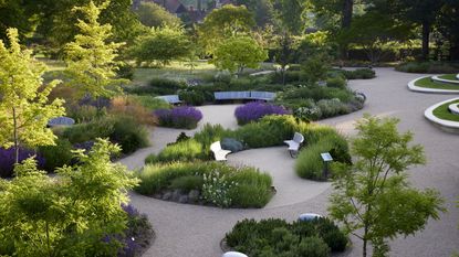 Garden design with curved planting beds, designed by Matt Keightley