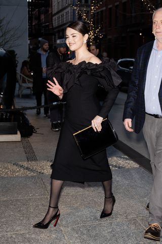 Selena Gomez wearing a black dress