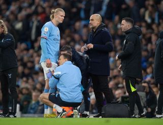 Erling Haaland of Manchester City receives treatment for a thigh injury during the Premier League match between Manchester City and Aston Villa at Etihad Stadium on February 12, 2023 in Manchester, United Kingdom.