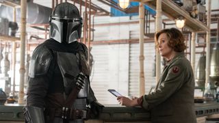 Pedro Pascal as Din Djarin and Sigourney Weaver as Colonel Ward in The Mandalorian and Grogu 