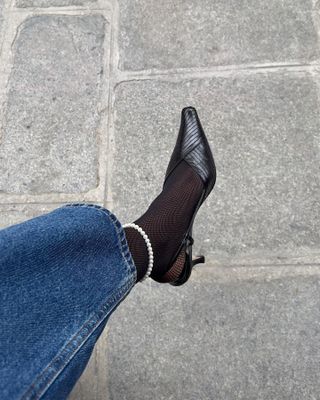 a woman in heels and tights