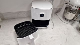 Xiaomi Mi Smart Air Fryer with the drawer removed on a kitchen counter