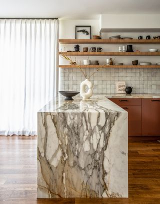 a marble kitchen island in a modern kitchen