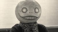 A screenshot of Yoko Taro in the "Message from NieR: Automata director Yoko Taro" Square Enix video announcing Nier: Automata's Steam release.