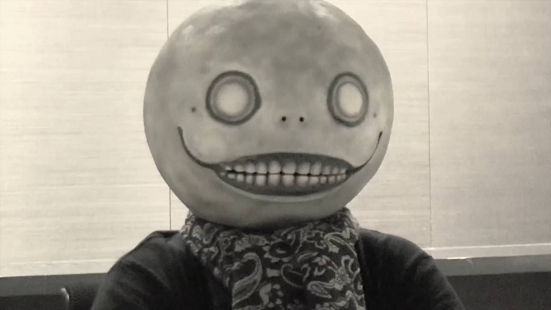 A screenshot of Yoko Taro in the "Message from NieR: Automata director Yoko Taro" Square Enix video announcing Nier: Automata's Steam release.
