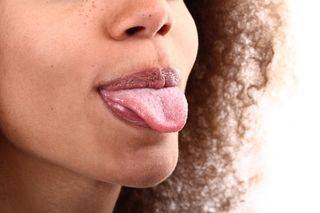 Woman sticking out tongue