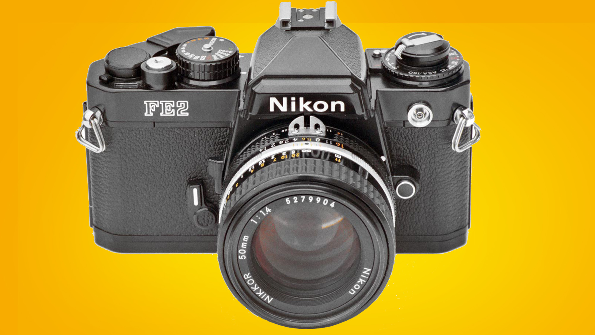 The NIkon FE2 camera on an orange background