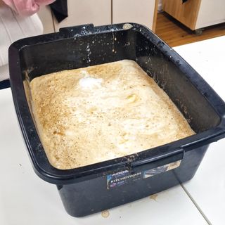 a container of soy sauce and dish soap