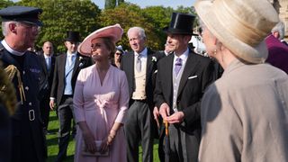 Duke and Duchess of Edinburgh speak to guests attending a Royal Garden Party