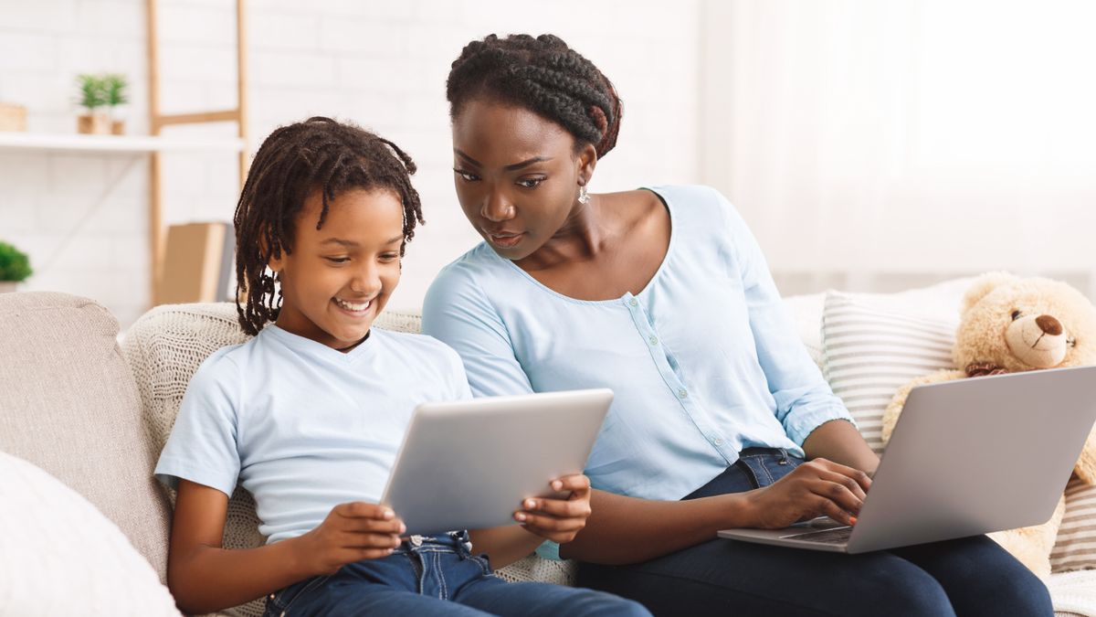 mother watching her daughter&#039;s activity online