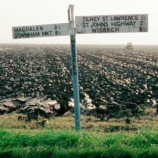 locations stand on road at countryside and field