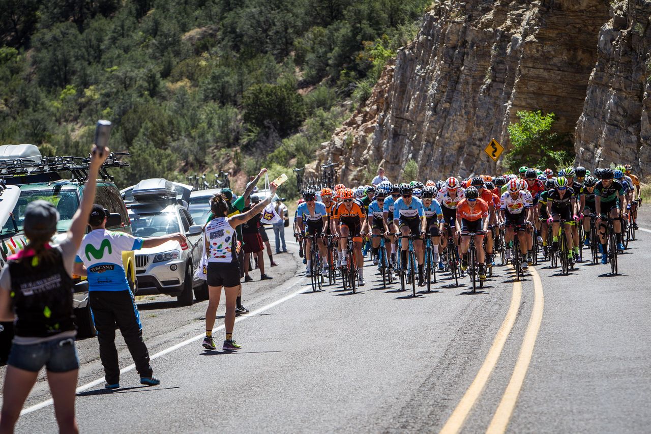 The men roll through the feed zone.