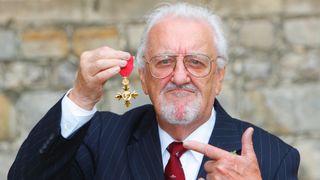 Bernard Cribbins poses with his OBE medal in 2011