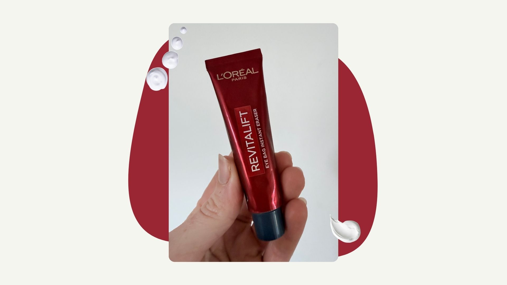 Woman holding L&#039;Oreal Paris eye bag cream