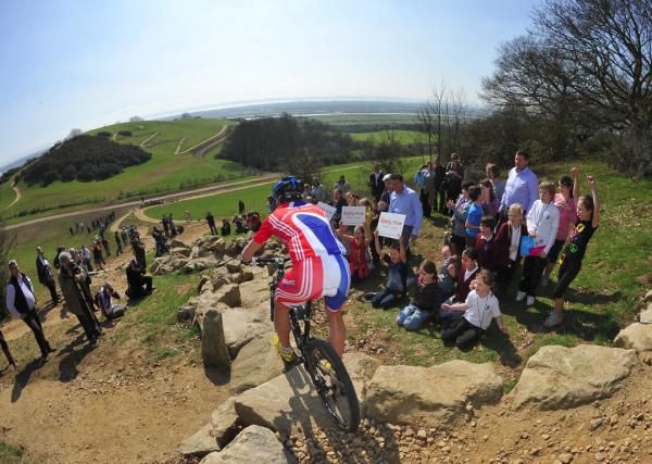 A British team racer rides a technical section on the newly completed 2012 Olympic Games mountain bike course