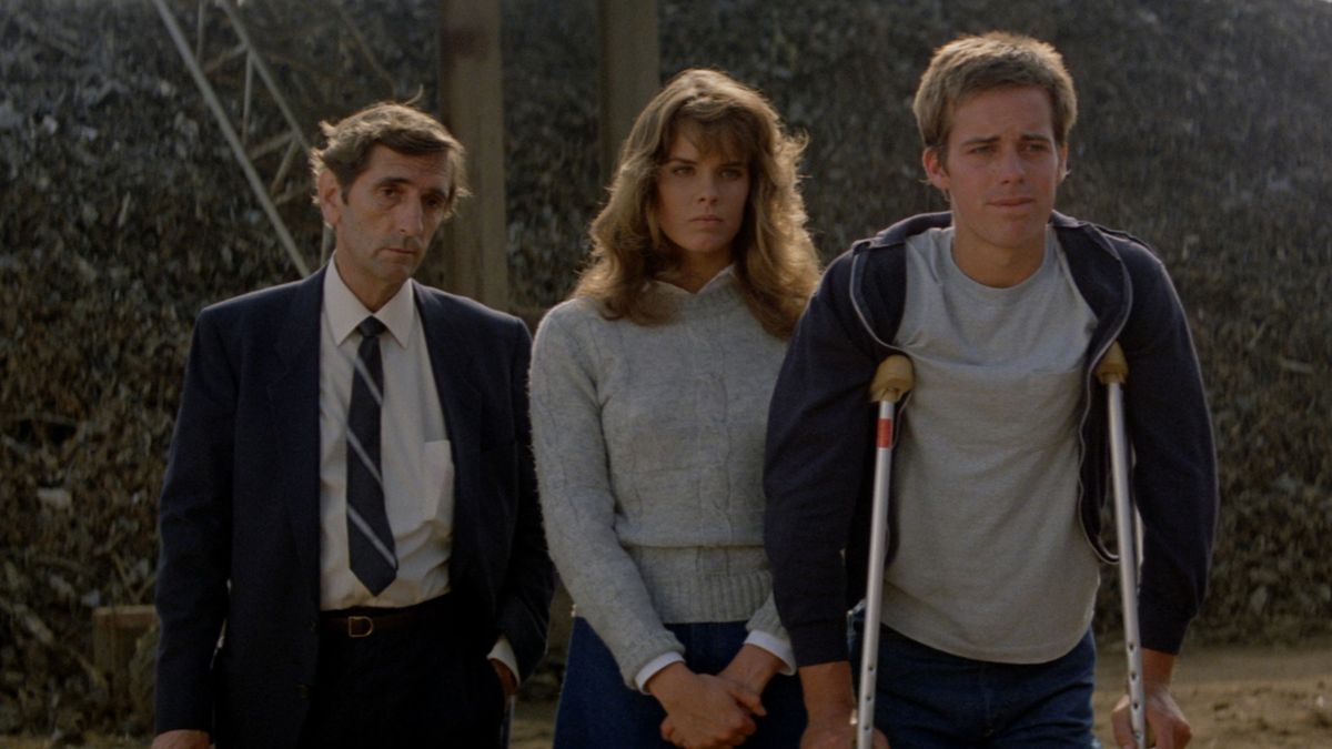 Alexandra Paul, Harry Dean Stanton, and John Stockwell in John Carpenter&#039;s Christine