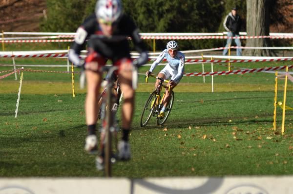 Adam Myerson (Cycle-Smart) chases a bunny hopping Jerome Townsend (BikeReg.com / Joe's Garage / Scott) over the barriers.