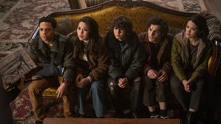 The Goosebumps cast sitting on a sofa with pure-black eyes