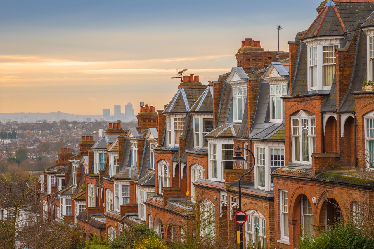 a street of period red-brick Victorian homes with traditional windows