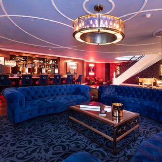 keston park mansion in kent bar with blue velvet sofas