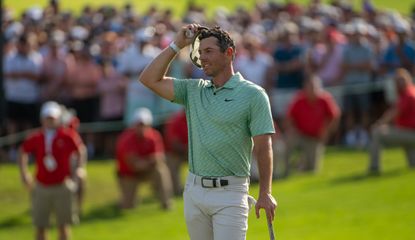 McIlroy wipes his brow holding his hat