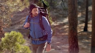 Man hiking wearing Garmin Epix (Gen 2) Pro watch