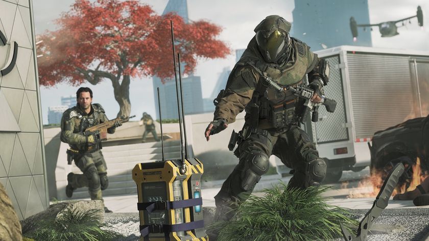 A soldier in heavy body armor defuses a yellow bomb