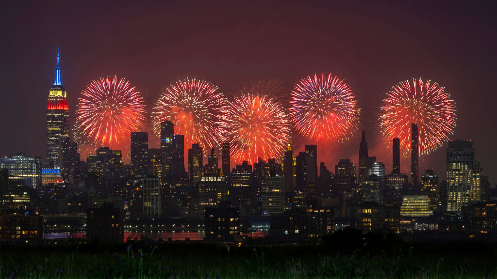 Macy's 4th of July fireworks light up the sky next to the Empire State Building in New York City on July 4, 2023, as seen from Union City, New Jersey.
