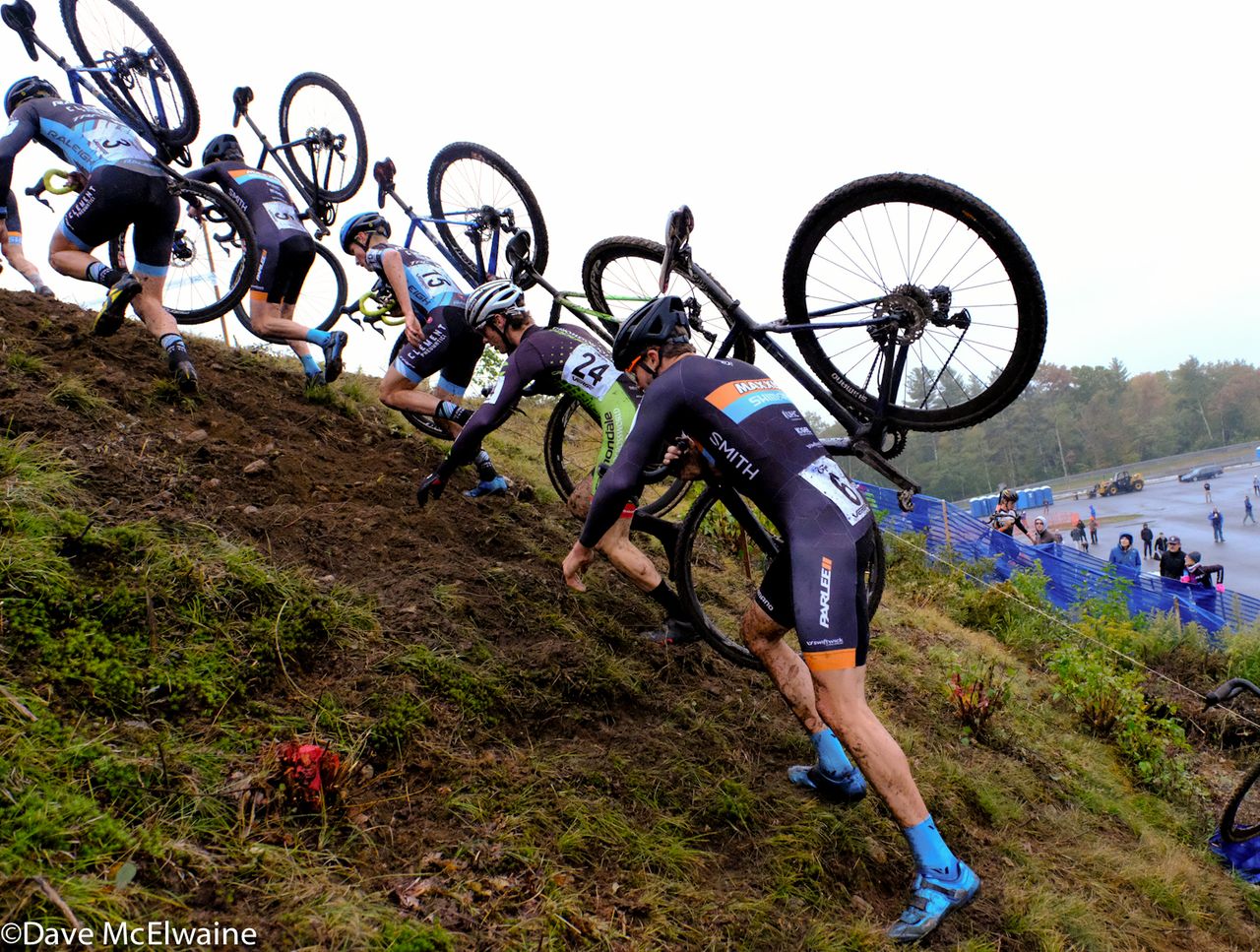 Danny Summerhill (Maxxis Shimano) and other chasers scramble up a steep embankment