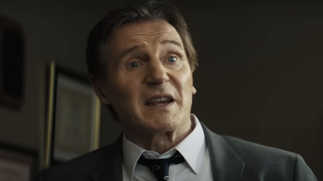 Frank Drebbin Jr. talking in office in The Naked Gun reboot