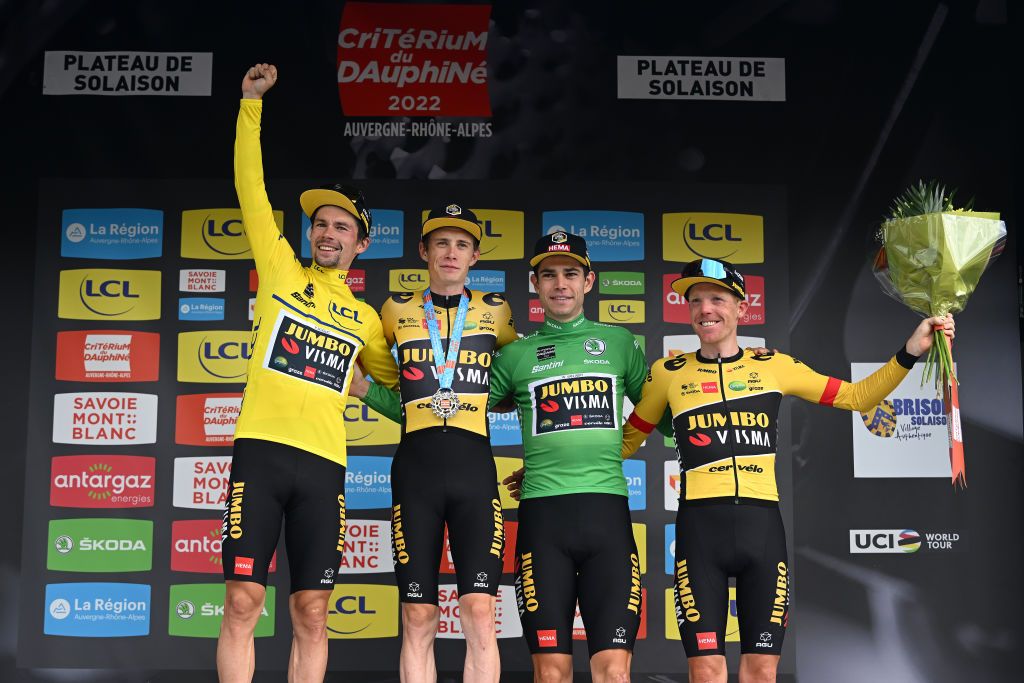 PLATEAU DE SALAISON FRANCE JUNE 12 LR Primoz Roglic of Slovenia Yellow Leader Jersey Jonas Vingegaard Rasmussen of Denmark Wout Van Aert of Belgium Green Points Jersey and Steven Kruijswijk of Netherlands and Team Jumbo Visma celebrate at podium as best team prize winner after the 74th Criterium du Dauphine 2022 Stage 8 a 1388km stage from SaintAlbanLeysse to Plateau de Salaison 1495m WorldTour Dauphin on June 12 2022 in Plateau de Salaison France Photo by Dario BelingheriGetty Images